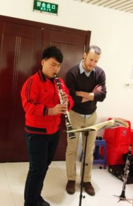 Mark Kleine, currently accepting student for clarinet lessons in Ann Arbor, teaches a student during a masterclass in Ordos, China