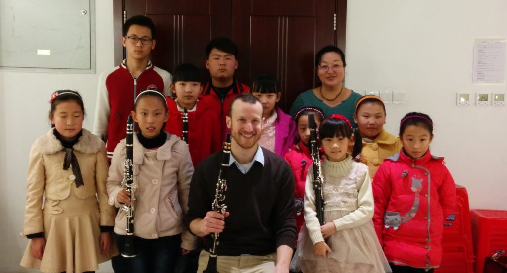 Mark Kleine, clarinetist and teacher, poses with a group of students following a master class in Ordos, China